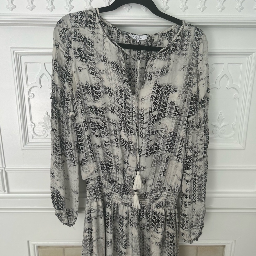 Parker black and white boho drop waist mini with tassels, size m.